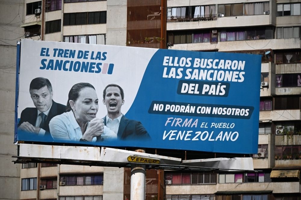 Nobel laureate Maria Corina Machado: The face and fire of Venezuela’s opposition A billboard accusing opposition leaders (from left) Leopoldo Lopez, Maria Corina Machado and Juan Guaido, for the US sanctions imposed on the country, is seen in Caracas on October 10, 2025, after Machado was awarded the Nobel Peace Prize. — AFP pic