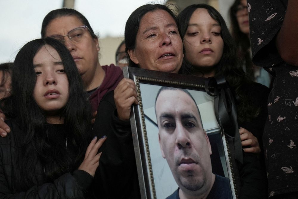 Chicago ICE crackdown’s first casualty, a father of two, had built a quiet life in the US Graciela holds a framed photo of her brother, Silverio Villegas Gonzalez, 38, a man from Michoacan who was fatally shot by a US Immigration and Customs Enforcement (ICE) agent in Franklin Park, Illinois, shortly after dropping off his two children at a nearby elementary school and daycare, during his burial at a cemetery in Irimbo, Mexico, September 26, 2025. — Reuters pic