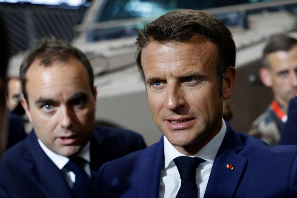 Macron hits rewind: France gets the same prime minister twice in one week Emmanuel Macron (right) and Sebastien Lecornu visit the booth of the French Ministry of Armed Forces at the Eurosatory trade fair in Villepinte, north of Paris, on June 13, 2022. — AFP pic