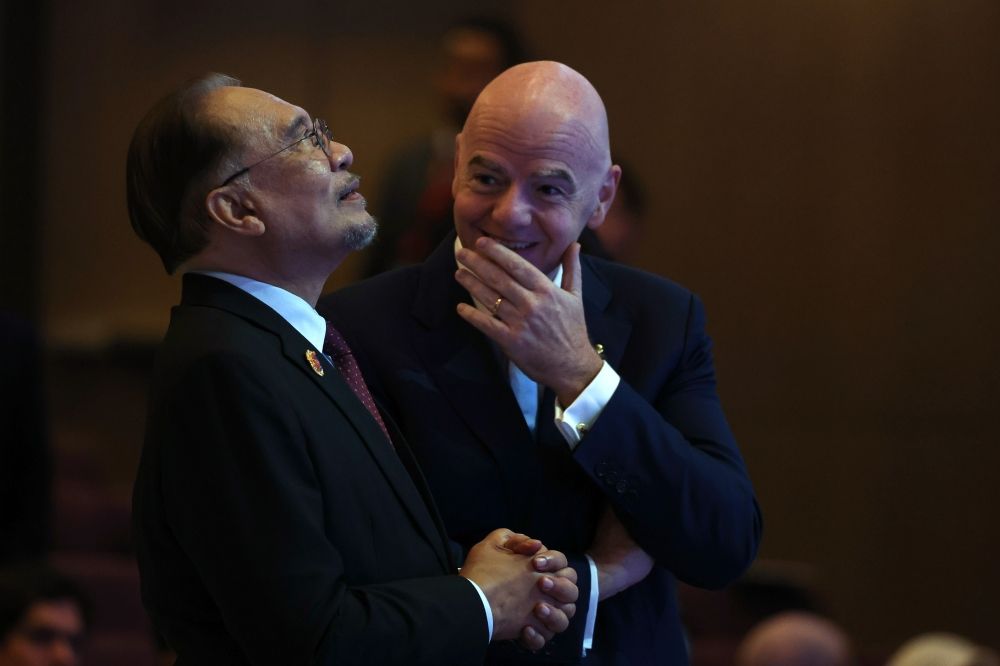 Prime Minister Datuk Seri Anwar Ibrahim shares a cheerful moment with Fifa President Gianni Infantino during the signing ceremony of the Asean-Fifa Memorandum of Understanding,on sidelines of the 47th Asean Summit and Related Summits at the Kuala Lumpur Convention Centre (KLCC) yesterdau. — Bernama pic Prime Minister Datuk Seri Anwar Ibrahim shares a cheerful moment with Fifa President Gianni Infantino during the signing ceremony of the Asean-Fifa Memorandum of Understanding,on sidelines of the 47th Asean Summit and Related Summits at the Kuala Lumpur Convention Centre (KLCC) yesterdau. — Bernama pic