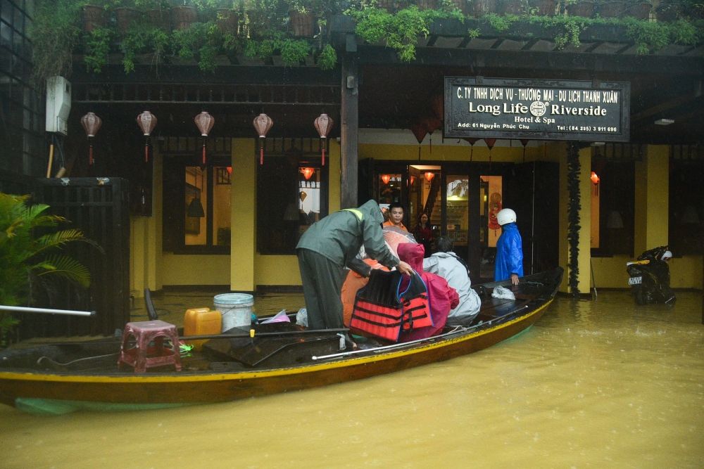 People are evacuated from a hotel on a boat in flood waters following heavy rains in Hoi An in central Vietnam on October 27, 2025. — AFP pic People are evacuated from a hotel on a boat in flood waters following heavy rains in Hoi An in central Vietnam on October 27, 2025. — AFP pic