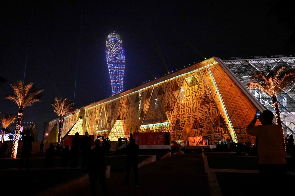 Lightning effects depicting the sarcophagus Egyptian King Tutankhamun light up the sky during the opening ceremony of the Grand Egyptian Museum (GEM) in Giza, on the southwestern outskirts of the capital Cairo on November 1, 2025. — AFP pic Lightning effects depicting the sarcophagus Egyptian King Tutankhamun light up the sky during the opening ceremony of the Grand Egyptian Museum (GEM) in Giza, on the southwestern outskirts of the capital Cairo on November 1, 2025. — AFP pic
