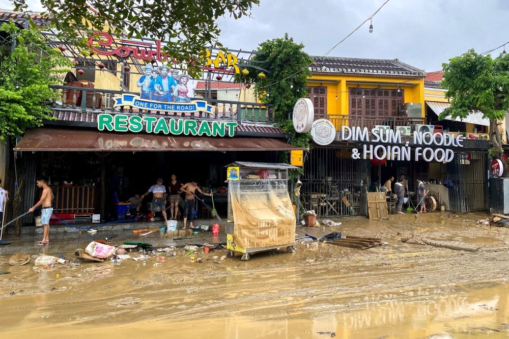 People clean a restaurant following floods in central Vietnam that have killed several people, in Hoi An, Vietnam November 1, 2025. — Reuters pic People clean a restaurant following floods in central Vietnam that have killed several people, in Hoi An, Vietnam November 1, 2025. — Reuters pic