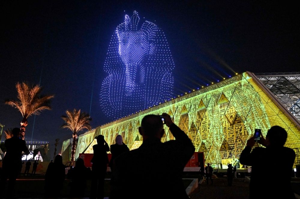 Egypt opens grand museum in lavish, pharaonic ceremony after two-decade wait Lightning effects depicting the funerary mask of ancient Egyptian King Tutankhamun light up the sky during the opening ceremony of the Grand Egyptian Museum (GEM) in Giza, on the southwestern outskirts of the capital Cairo on November 1, 2025. Near the ancient Pyramids of Giza just outside Cairo, the Grand Egyptian Museum is gearing up for a lavish opening on November 1, after two decades of delays. — AFP pic