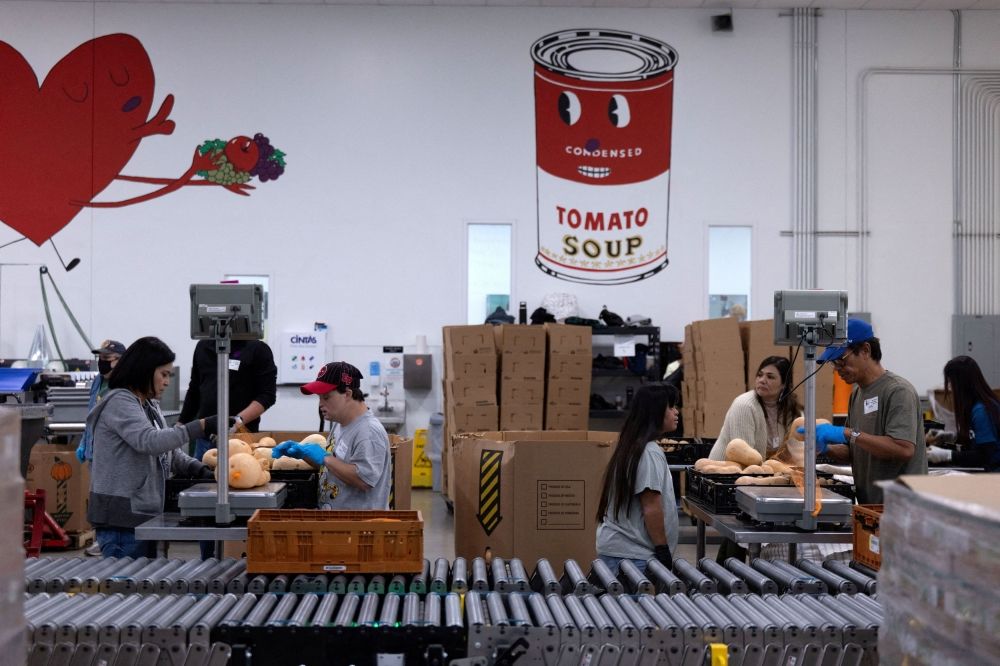 Volunteers weigh squash and potatoes to add to produce bags for mobile party distribution sites at the Central Texas Food Bank warehouse kitchen, as nearly 42 million Americans face a potential lapse in Supplemental Nutrition Assistance Programme (SNAP) benefits, known as food stamps, due to the second-longest US government shutdown, in Austin, Texas October 30, 2025. — Reuters pic Volunteers weigh squash and potatoes to add to produce bags for mobile party distribution sites at the Central Texas Food Bank warehouse kitchen, as nearly 42 million Americans face a potential lapse in Supplemental Nutrition Assistance Programme (SNAP) benefits, known as food stamps, due to the second-longest US government shutdown, in Austin, Texas October 30, 2025. — Reuters pic