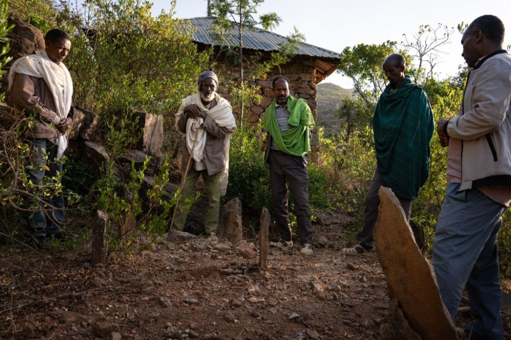 A group of diggers and a relative of the victims prepare to open a mass grave containing three bodies on a mountain in Adwa, Ethiopia on March 31, 2025. — AFP pic A group of diggers and a relative of the victims prepare to open a mass grave containing three bodies on a mountain in Adwa, Ethiopia on March 31, 2025. — AFP pic