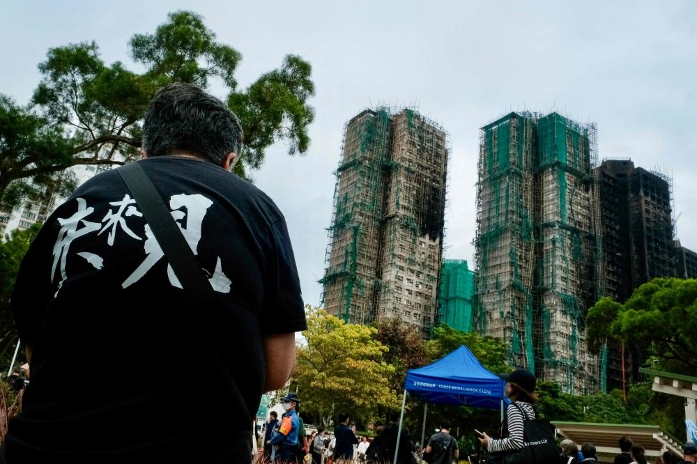Hong Kong authorities have faulted mesh netting for the deadly fire at the Wang Fuk Court apartments on November 26, 2025 that killed over 150 people so far. — AFP pic Hong Kong authorities have faulted mesh netting for the deadly fire at the Wang Fuk Court apartments on November 26, 2025 that killed over 150 people so far. — AFP pic