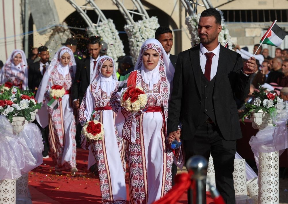 ‘Joy will rise again’: Mass wedding brings hope to war-scarred Gaza Palestinian couples attend a mass wedding in Khan Younis, in the southern Gaza Strip December 2, 2025. — Reuters pic