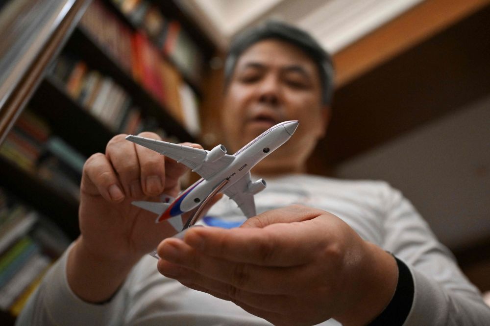 Jiang Hui, 52, has spent more than a decade seeking answers alongside the relatives of other Chinese victims. — AFP pic