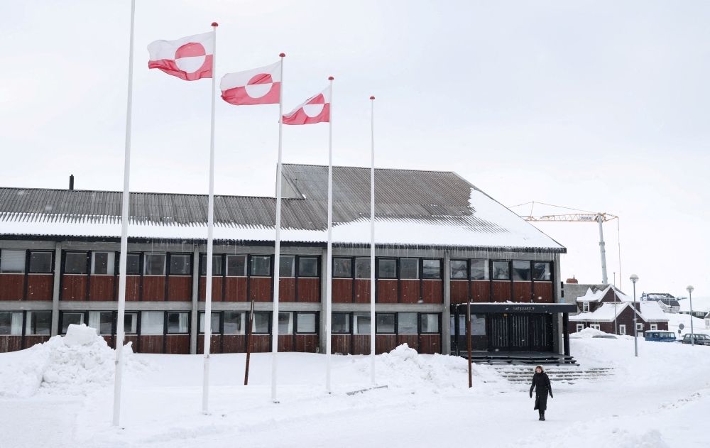 ‘American? No!’ says Greenland after Trump warns US will act ‘one way or another’ A woman walks past Greenland's parliament Inatsisartut in Nuuk, Greenland, March 28, 2025. — Reuters pic