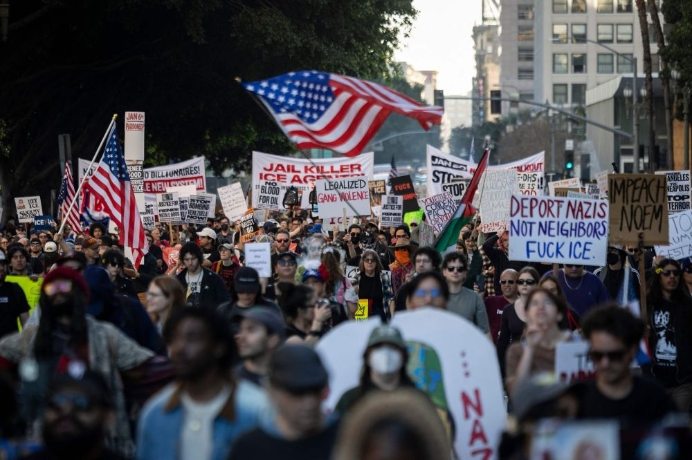 Three days on, nationwide protests continue against ICE over Renee Good shooting People wave flags and hold signs during a protest in Los Angeles, California on January 10, 2026 against US Immigration and Customs Enforcement (ICE) after the fatal shooting of Renee Nicole Good in Minneapolis. — AFP