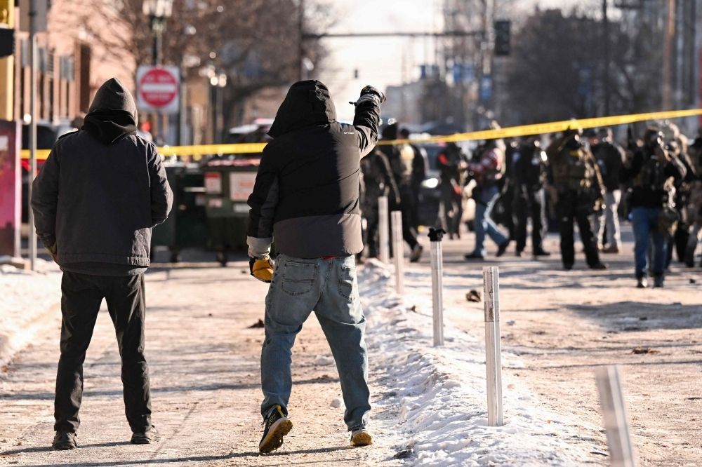 Second civilian shot dead by US immigration agents in Minneapolis sparks outrage Demonstrators gather near the site of where state and local authorities say a man was shot by federal agents earlier in the morning in Minneapolis, Minnesota, on January 24, 2026. — AFP pic