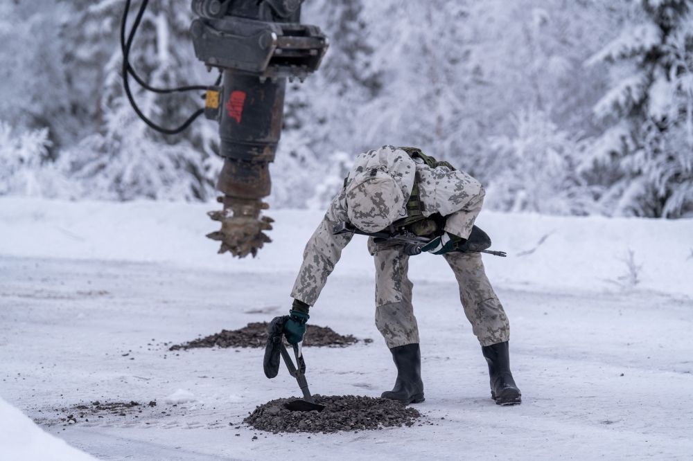 In Finland's forests, soldiers re-learn how to lay anti-personnel mines as Russia threat grows Finnish Military personnel wearing winter camouflage uniforms demonstrates the installation of land mines, as an excavator digs into the frozen asphalt to bury practice anti-tank mines that were never banned, during a media day event at the Kainuu Brigade, a Finnish Army unit in Kajaani, Finland on February 3, 2026. — AFP pic