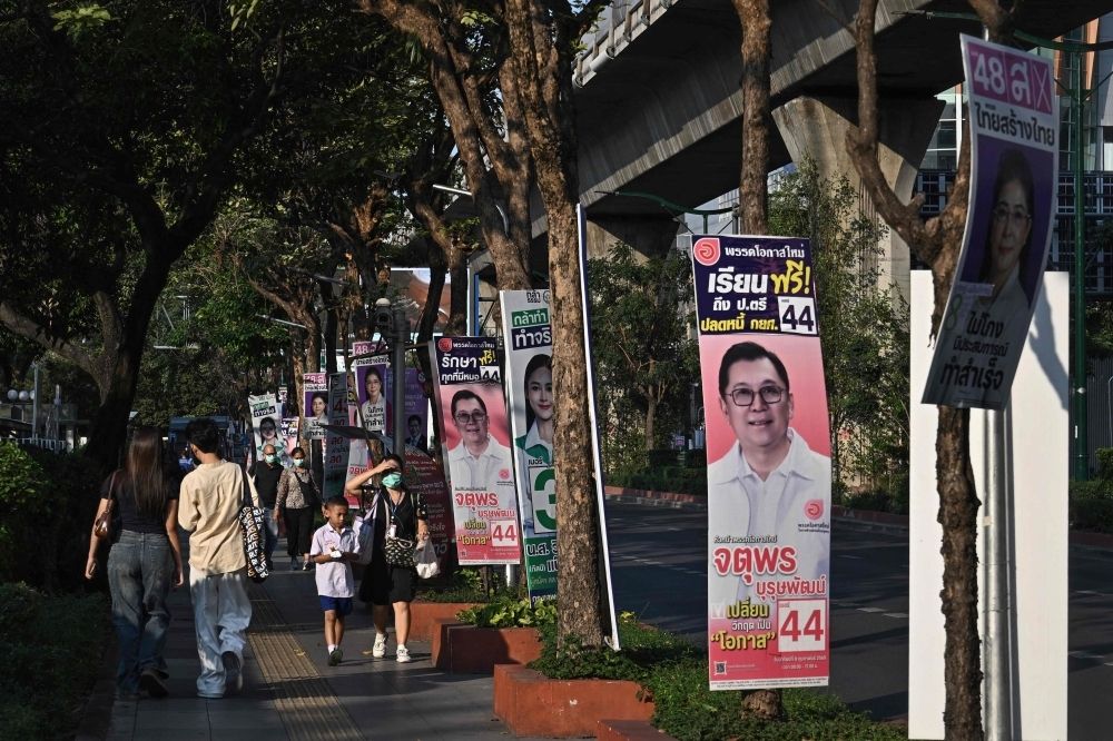 Timeline: Two decades of turmoil in Thai politics ahead of 2026 election People walk past campaign posters before the February 8 general election in Bangkok on February 2, 2026. — AFP pic