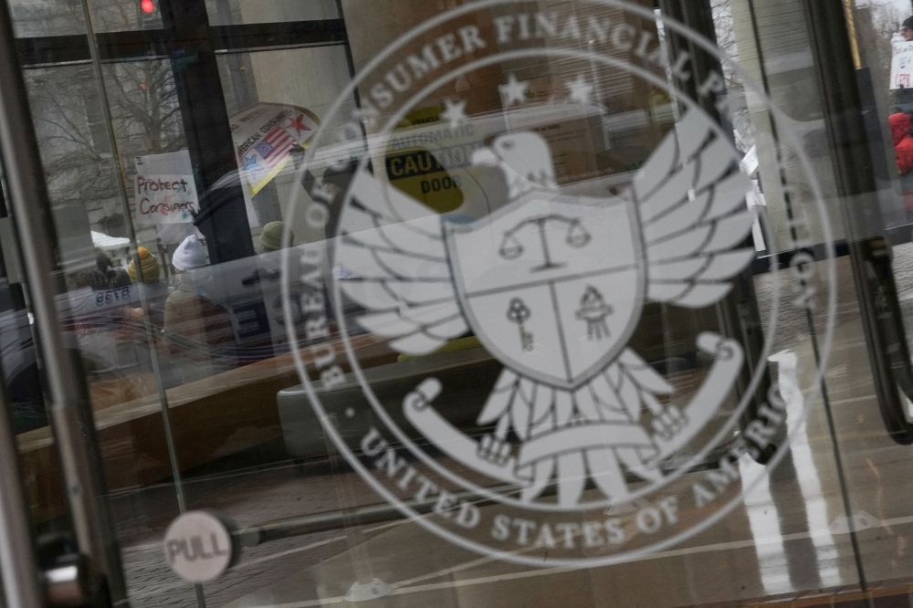 Demonstrators take part in a protest by the Consumer Financial Protection Bureau (CFPB) building, the day after members of Elon Musk's Department of Government Efficiency (DOGE) moved into the CFPB, in Washington February 8, 2025. — Reuters pic Demonstrators take part in a protest by the Consumer Financial Protection Bureau (CFPB) building, the day after members of Elon Musk's Department of Government Efficiency (DOGE) moved into the CFPB, in Washington February 8, 2025. — Reuters pic