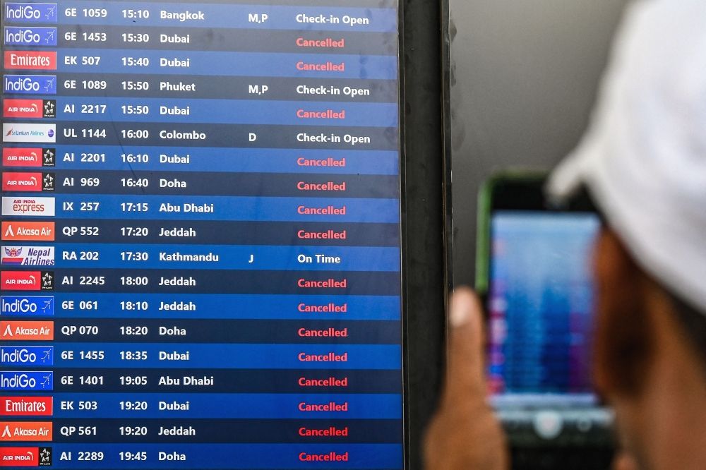 A passenger takes pictures of a flight information board at the Chhatrapati Shivaji Maharaj International Airport in Mumbai on March 1, 2026 after India's two largest private carriers IndiGo and Air India suspended flights to all destinations in the Middle East. Thousands of flights have been delayed or cancelled in the biggest disruption to global air transport since the Covid pandemic as airlines suspend services to the Middle East following the US and Israeli attacks on Iran. — AFP pic A passenger takes pictures of a flight information board at the Chhatrapati Shivaji Maharaj International Airport in Mumbai on March 1, 2026 after India's two largest private carriers IndiGo and Air India suspended flights to all destinations in the Middle East. Thousands of flights have been delayed or cancelled in the biggest disruption to global air transport since the Covid pandemic as airlines suspend services to the Middle East following the US and Israeli attacks on Iran. — AFP pic