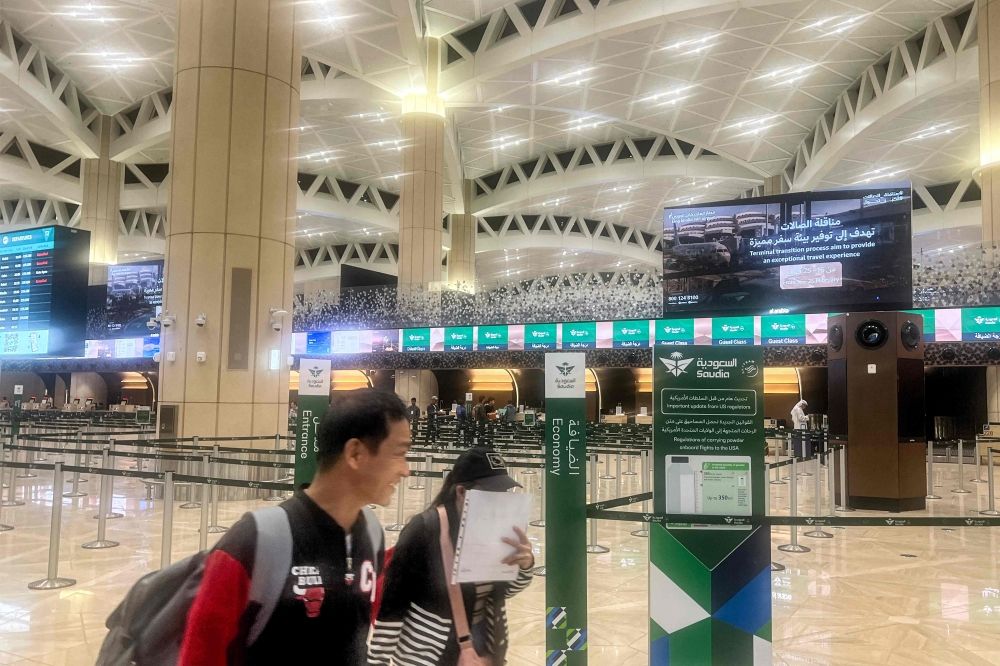 Travellers walk at the empty terminal at King Khalid International Airport in Riyadh on March 1, 2026. — AFP pic Travellers walk at the empty terminal at King Khalid International Airport in Riyadh on March 1, 2026. — AFP pic