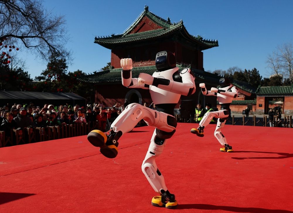 People watch as robots perform a dance during Lunar New Year celebrations marking the Year of the Horse, in Beijing February 18, 2026. — Reuters pic People watch as robots perform a dance during Lunar New Year celebrations marking the Year of the Horse, in Beijing February 18, 2026. — Reuters pic