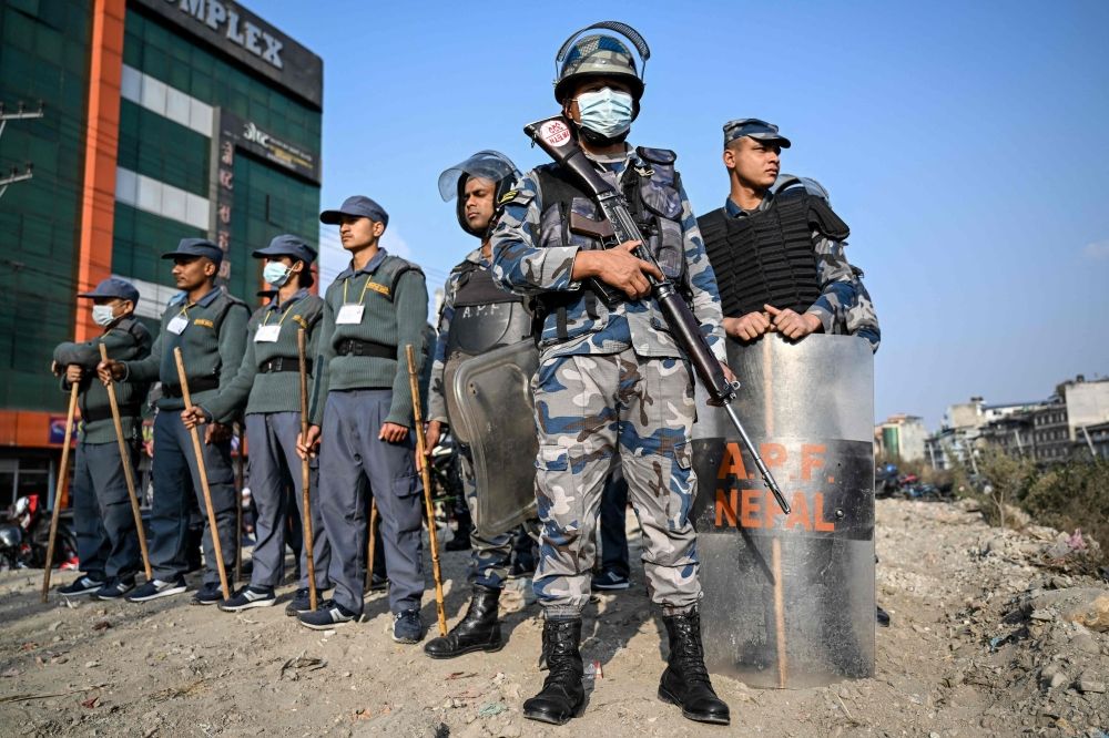 Security personnel stand guard during a rally of Nepali Congress party president and election candidate Gagan Thapa in Kathmandu on March 1, 2026. — AFP pic Security personnel stand guard during a rally of Nepali Congress party president and election candidate Gagan Thapa in Kathmandu on March 1, 2026. — AFP pic
