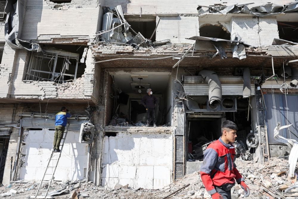People inspect a damaged building, in the aftermath of a strike on a police station, amid the US-Israeli conflict with Iran, in Tehran March 4, 2026. — Majid Asgaripour/Wana (West Asia News Agency) pic via Reuters People inspect a damaged building, in the aftermath of a strike on a police station, amid the US-Israeli conflict with Iran, in Tehran March 4, 2026. — Majid Asgaripour/Wana (West Asia News Agency) pic via Reuters