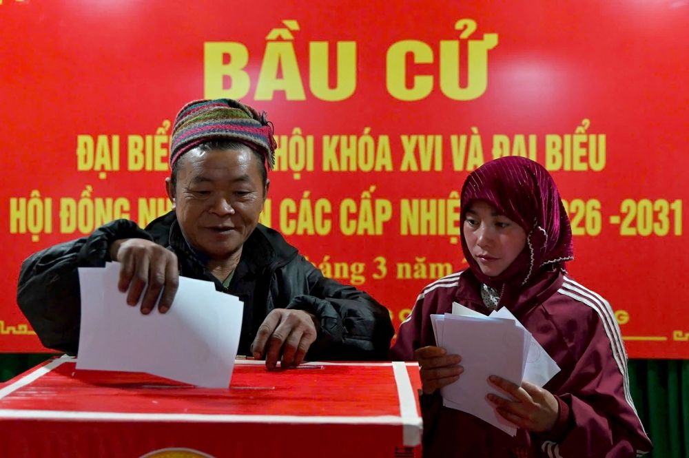 Ethnic minority citizens cast their votes inside a polling station in the northern Vietnamese province of Tuyen Quang on March 15, 2026. — AFP pic Ethnic minority citizens cast their votes inside a polling station in the northern Vietnamese province of Tuyen Quang on March 15, 2026. — AFP pic