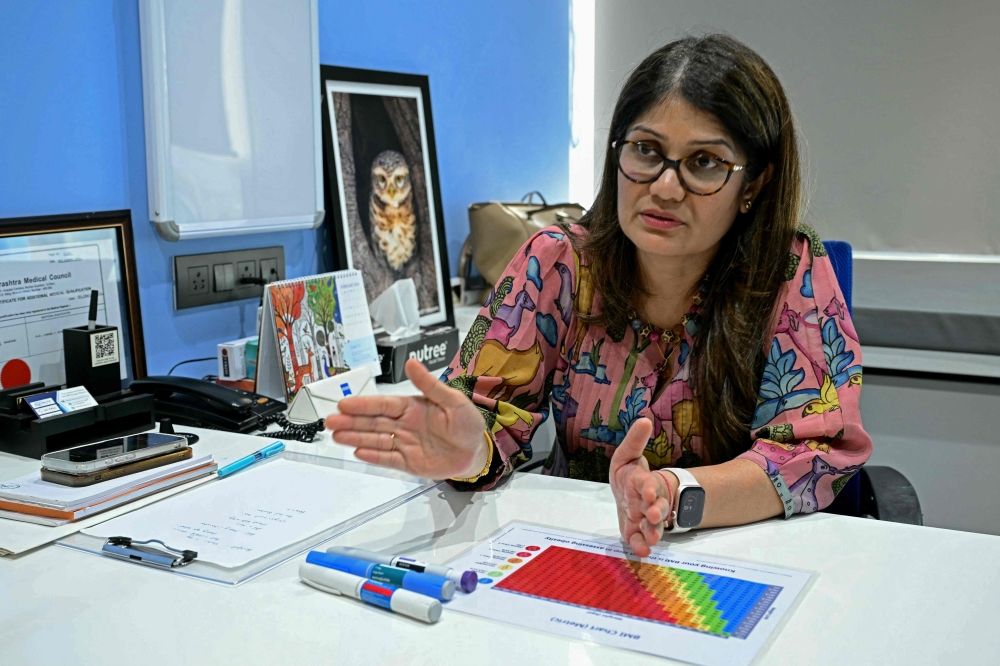 This photograph taken on March 17, 2026 shows obesity doctor and consultant Swati Pradhan explaining a body mass index (BMI) chart at her clinic in Mumbai. — AFP pic This photograph taken on March 17, 2026 shows obesity doctor and consultant Swati Pradhan explaining a body mass index (BMI) chart at her clinic in Mumbai. — AFP pic
