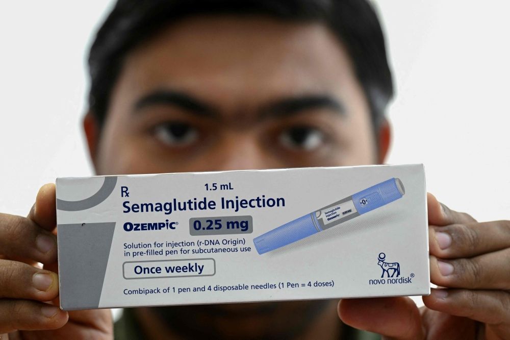 A medicine distributor displays a pack of Ozempic (semaglutide) self-injecting GLP-1 prefilled pens at his office in Thane on March 20, 2026. — AFP pic A medicine distributor displays a pack of Ozempic (semaglutide) self-injecting GLP-1 prefilled pens at his office in Thane on March 20, 2026. — AFP pic