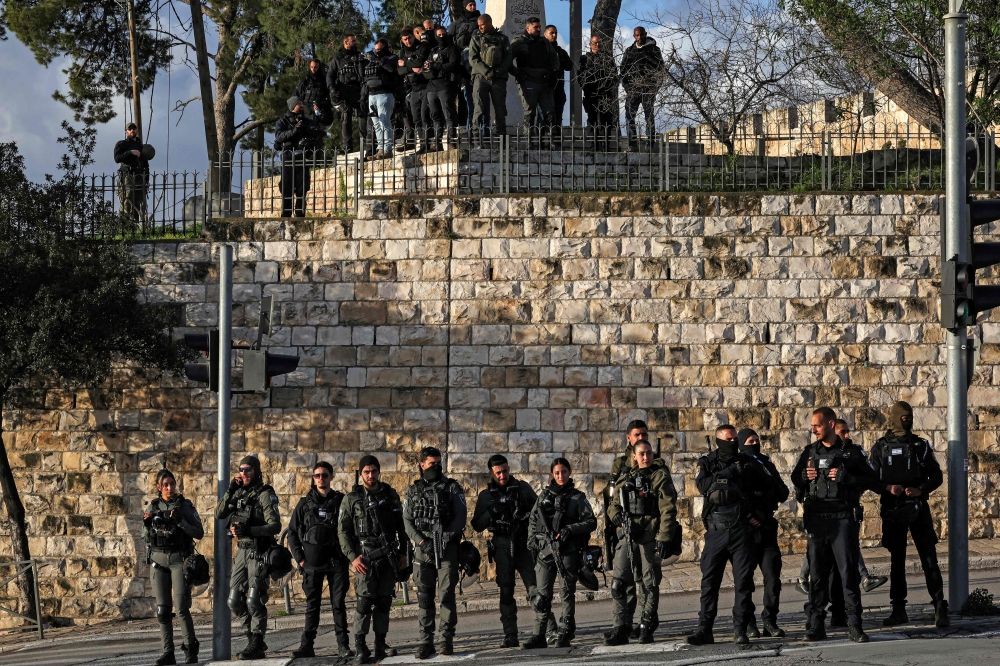 Israeli security forces stand guard as Muslim worshippers gather outside the Jerusalem old city walls on March 20, 2026 to attend attend the early morning prayers for Eid al-Fitr, marking the end of the holy month of Ramadan. — AFP pic Israeli security forces stand guard as Muslim worshippers gather outside the Jerusalem old city walls on March 20, 2026 to attend attend the early morning prayers for Eid al-Fitr, marking the end of the holy month of Ramadan. — AFP pic