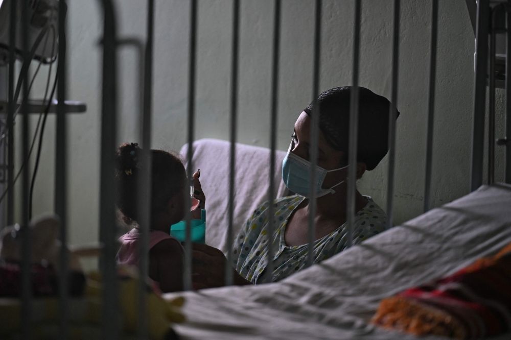 A woman cares for her daughter at the William Soler Pediatric Cardiocenter in Havana on March 24, 2026. — AFP pic A woman cares for her daughter at the William Soler Pediatric Cardiocenter in Havana on March 24, 2026. — AFP pic