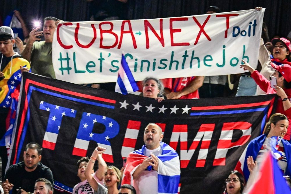 People hold Cuban flags and a flag supporting US President Donald Trump while participating in the “Cuba Libre” demonstration in the city of Hialeah, Florida on March 24, 2026. — AFP pic People hold Cuban flags and a flag supporting US President Donald Trump while participating in the “Cuba Libre” demonstration in the city of Hialeah, Florida on March 24, 2026. — AFP pic