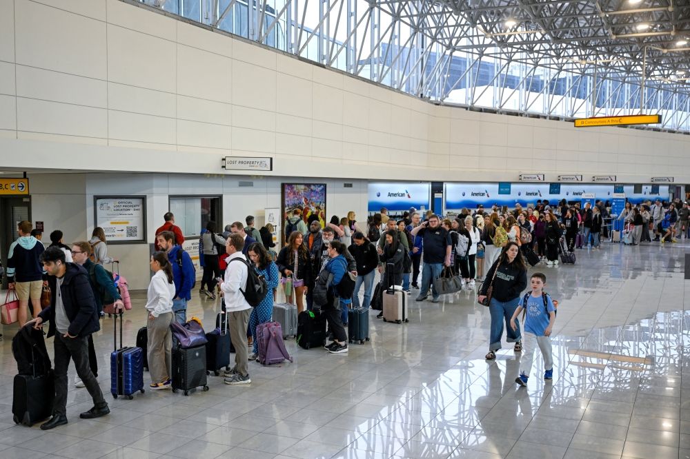 Passengers stand in the TSA line after the US Senate voted to end a partial government shutdown that has caused severe delays at airports across the country, at Baltimore/Washington International Thurgood Marshall Airport (BWI), in Baltimore, Maryland March 27, 2026. — Reuters pic Passengers stand in the TSA line after the US Senate voted to end a partial government shutdown that has caused severe delays at airports across the country, at Baltimore/Washington International Thurgood Marshall Airport (BWI), in Baltimore, Maryland March 27, 2026. — Reuters pic