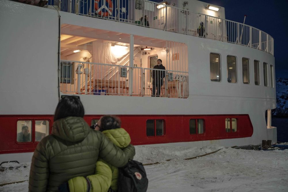 People watch from the ground as their loved ones board the Sarfaq Ittuk ferry at the port of Nuuk, Greenland, on March 13, 2026. — AFP pic People watch from the ground as their loved ones board the Sarfaq Ittuk ferry at the port of Nuuk, Greenland, on March 13, 2026. — AFP pic