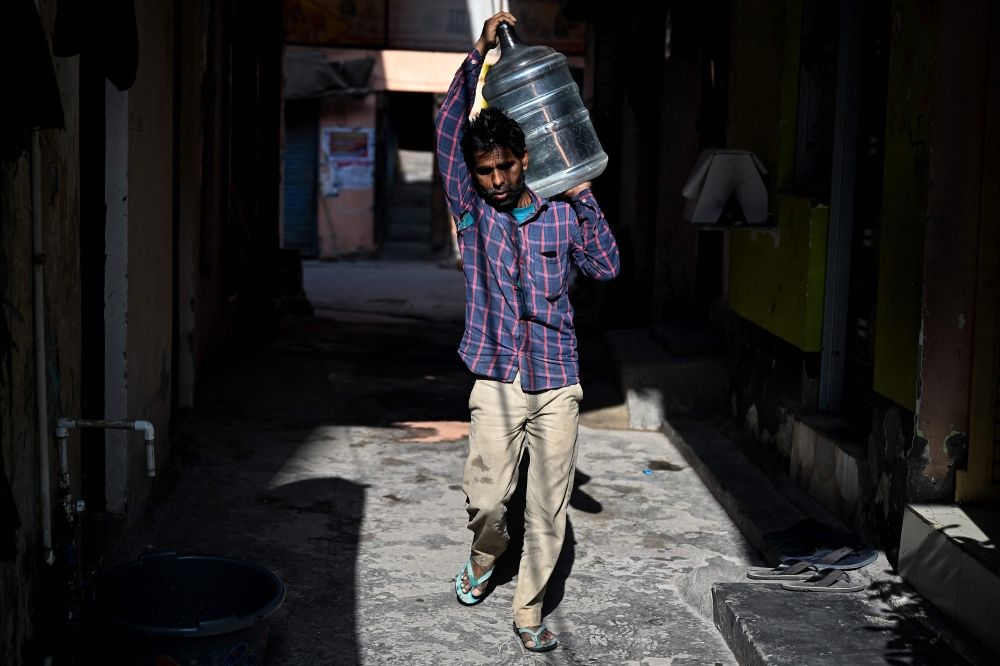 ‘We will leave when money runs out’: Migrant workers in Delhi hit by soaring LPG costs A migrant worker carries a plastic water container in New Delhi on April 9, 2026. Migrant workers in India's capital reeling from an energy crunch sparked by the Mideast war, are weighing whether to leave New Delhi for good. — AFP pic