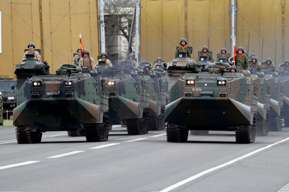 The US Army (left) and Japanese Self-Defence Forces’ (SDF) military vehicles parade during the annual SDF ceremony at Asaka Base in Asaka, north of Tokyo October 14, 2018. — Reuters pic The US Army (left) and Japanese Self-Defence Forces’ (SDF) military vehicles parade during the annual SDF ceremony at Asaka Base in Asaka, north of Tokyo October 14, 2018. — Reuters pic