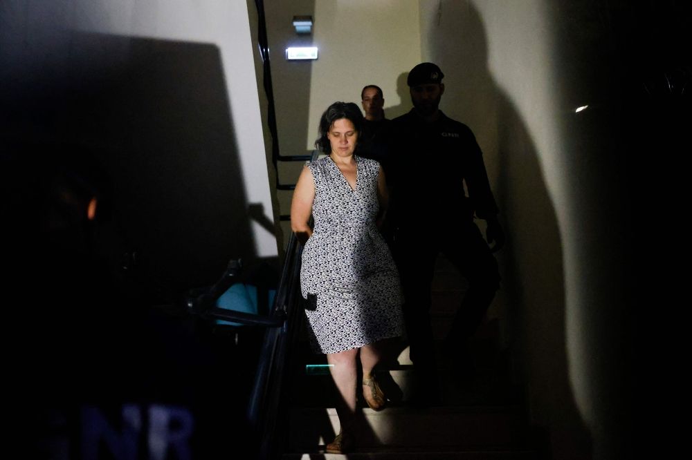 Frenchwoman Marine R. (left) leaves the Setubal courthouse, suspected of abandoning two children, in Setubal, Portugal May 23, 2026. — AFP pic Frenchwoman Marine R. (left) leaves the Setubal courthouse, suspected of abandoning two children, in Setubal, Portugal May 23, 2026. — AFP pic