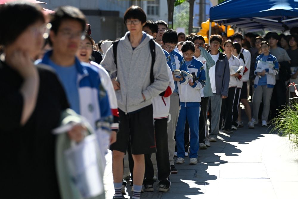 Gaokao jitters meet youth unemployment fears as 12.9 million students chase university dreams across China Students line up to enter a Beijing school on the first day of China’s gaokao, June 7, 2026. — AFP pic