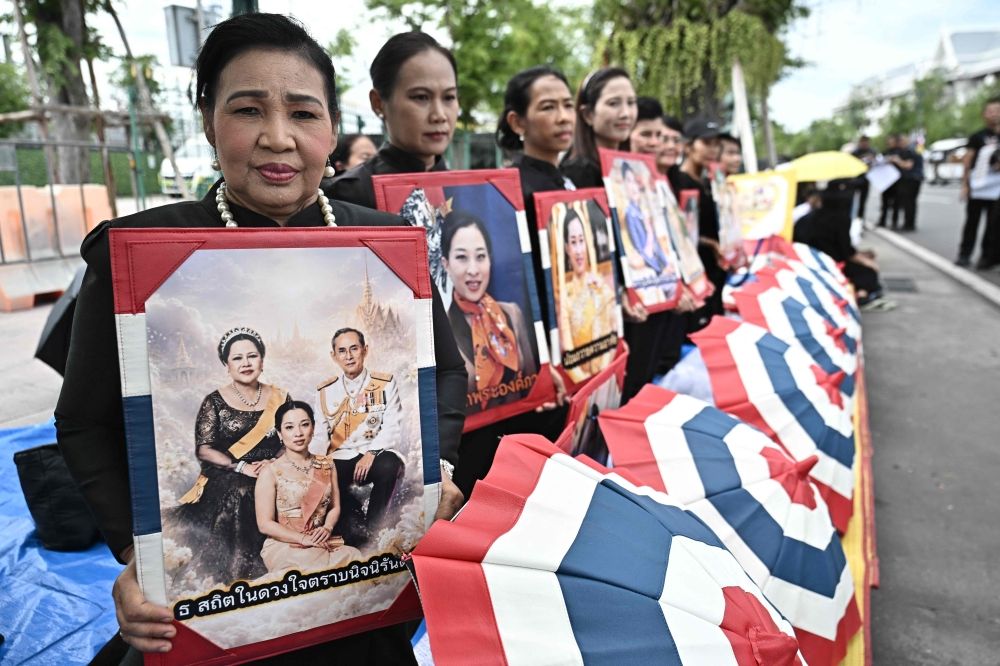 Royal protocol, grief and devotion converge in Bangkok palace as Thais bid farewell to Princess Bha Hundreds of black-clad Thai mourners gathered at the royal palace in Bangkok on June 13, 2026, awaiting the arrival of the body