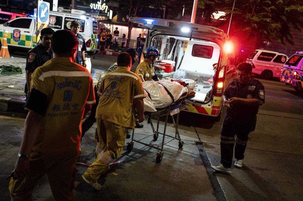 Emergency workers prepare to place the body of a victim into an ambulance in Bangkok early on July 13, 2026, after a fire in the Rong Beer Na Lat Phrao bar killed at least 27 people late Sunday night, Prime Minister Anutin Charnvirakul told local media. — AFP pic Emergency workers prepare to place the body of a victim into an ambulance in Bangkok early on July 13, 2026, after a fire in the Rong Beer Na Lat Phrao bar killed at least 27 people late Sunday night, Prime Minister Anutin Charnvirakul told local media. — AFP pic