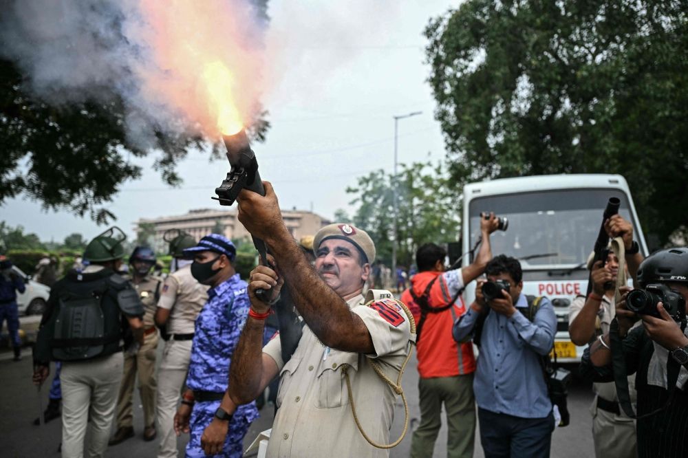 Indian police fire tear gas, baton-charge protesters as thousands demand action over exam leaks A police officer fires tear gas at Cockroach Janta Party supporters protesting alleged NEET examination irregularities in New Delhi on July 20, 2026. — AFP pic