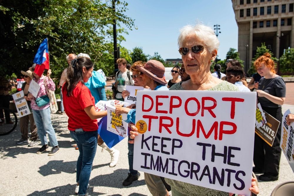 ‘Like a prisoner’: Haitian migrants in US face end of protected status after TPS termination People hold signs at a rally calling on Congress to restore Temporary Protected Status (TPS) for Haitians, in Boston, Massachusetts July 23, 2026. — AFP pic