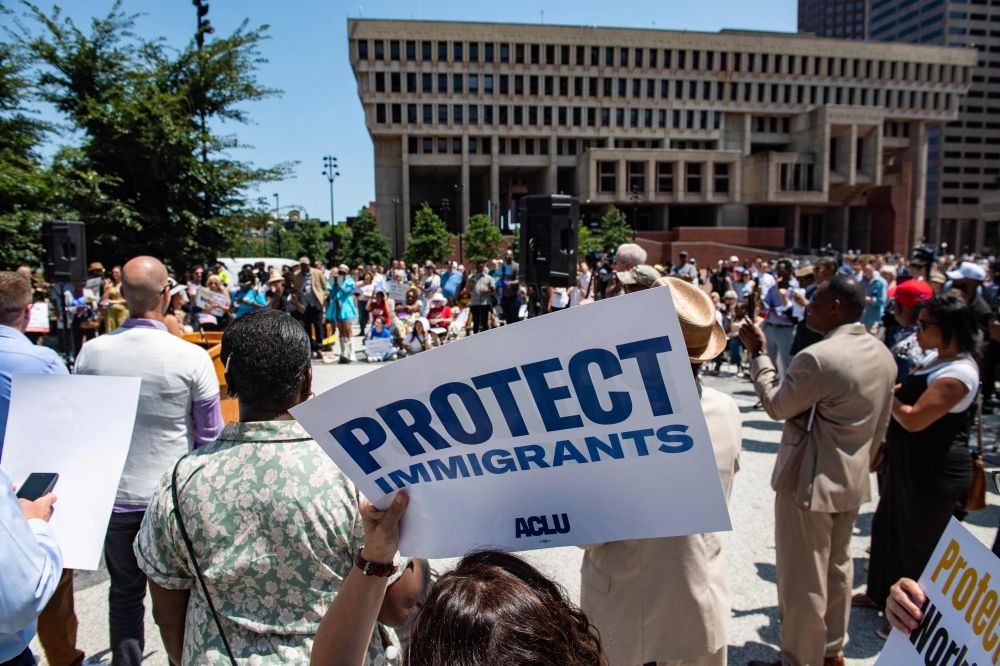 People hold signs at a rally calling on Congress to restore Temporary Protected Status (TPS) for Haitians, in Boston, Massachusetts July 23, 2026. — AFP pic People hold signs at a rally calling on Congress to restore Temporary Protected Status (TPS) for Haitians, in Boston, Massachusetts July 23, 2026. — AFP pic