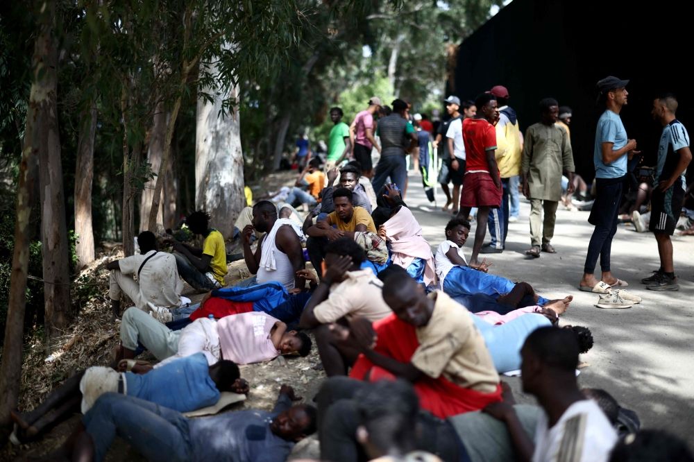 Migrants remain outside the CETI short-stay migrant centre in the Spanish North African enclave of Ceuta August 1, 2026. — AFP pic Migrants remain outside the CETI short-stay migrant centre in the Spanish North African enclave of Ceuta August 1, 2026. — AFP pic