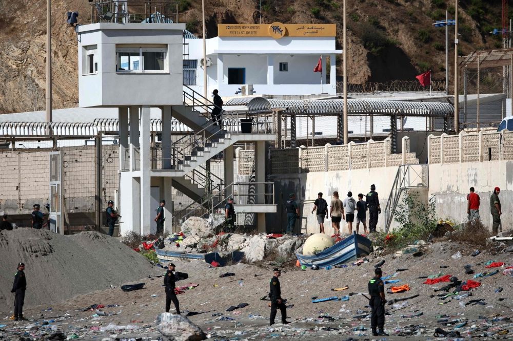 Some migrants arrive at the border post with the intention of crossing back into Morocco as members of the Spanish armed forces keep watch over the area in the Spanish enclave of Ceuta August 2, 2026. — AFP pic Some migrants arrive at the border post with the intention of crossing back into Morocco as members of the Spanish armed forces keep watch over the area in the Spanish enclave of Ceuta August 2, 2026. — AFP pic