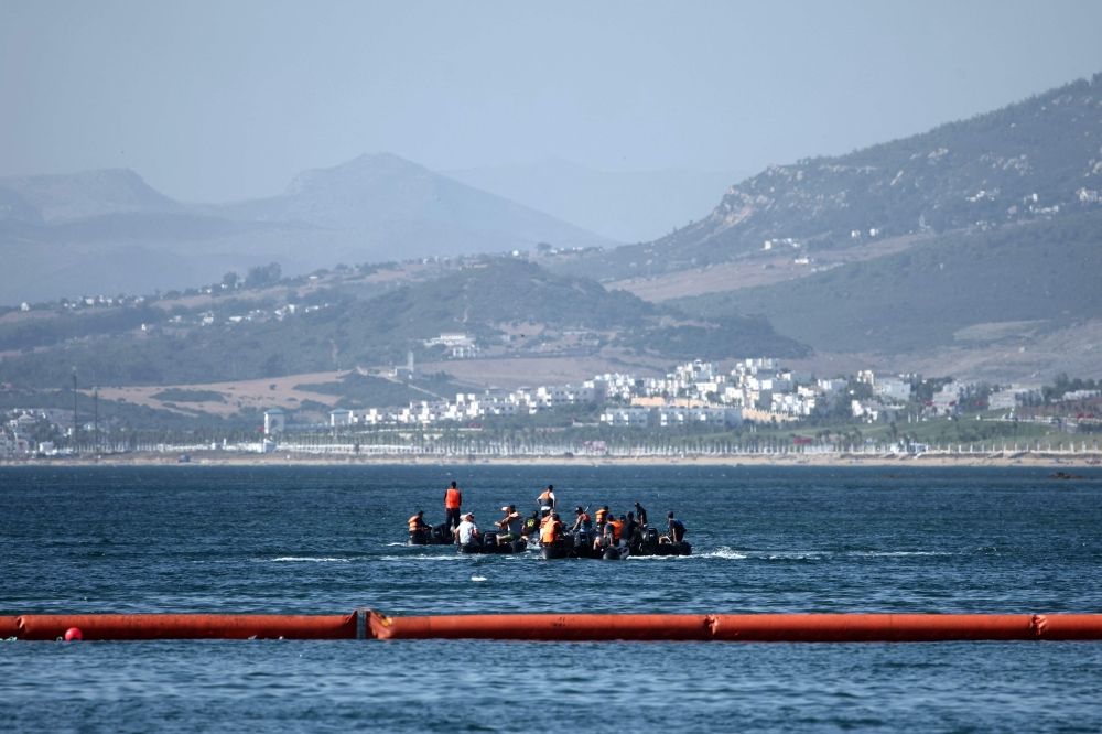 People aboard inflatable boats navigate on the Moroccan side of the new floating barrier deployed by Spain to reinforce security near the border post of the Spanish enclave of Ceuta on August 2, 2026. — AFP pic People aboard inflatable boats navigate on the Moroccan side of the new floating barrier deployed by Spain to reinforce security near the border post of the Spanish enclave of Ceuta on August 2, 2026. — AFP pic