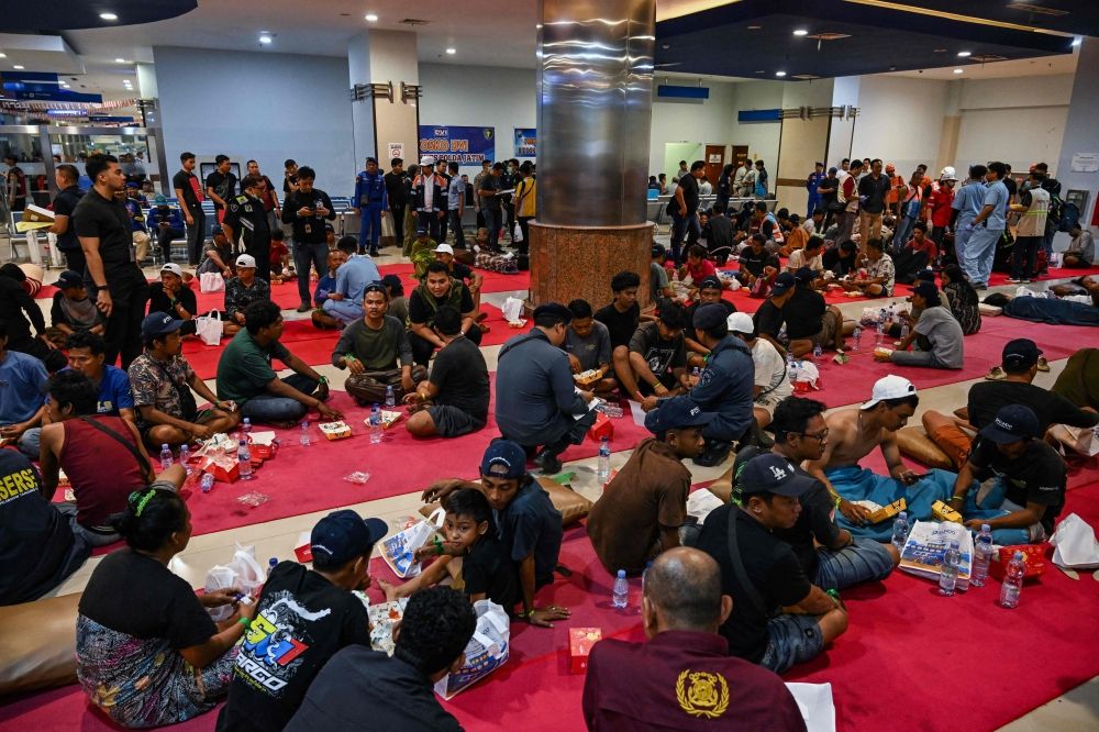 Survivors of the Mutiara Sentosa 2 ferry which caught fire in the waters off Madura island, East Java, on August 2, 2026, gather at Tanjung Perak port in Surabaya early on August 3, 2026. — AFP pic Survivors of the Mutiara Sentosa 2 ferry which caught fire in the waters off Madura island, East Java, on August 2, 2026, gather at Tanjung Perak port in Surabaya early on August 3, 2026. — AFP pic