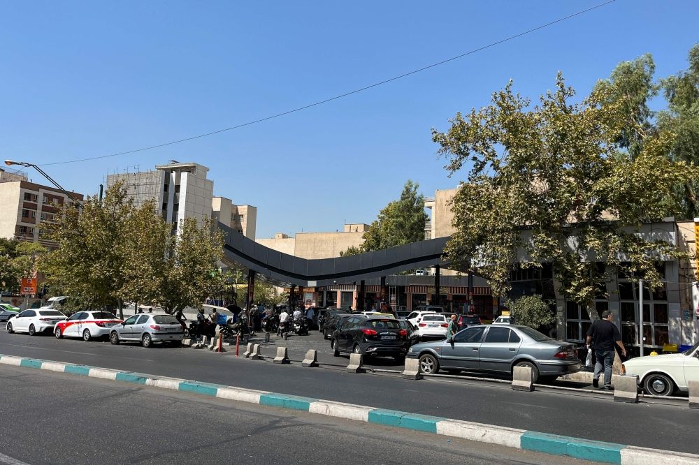 Cars queue at petrol stations in Iran after authorities announced plans to reduce petrol quotas while keeping subsidised prices unchanged. — AFP pic Cars queue at petrol stations in Iran after authorities announced plans to reduce petrol quotas while keeping subsidised prices unchanged. — AFP pic