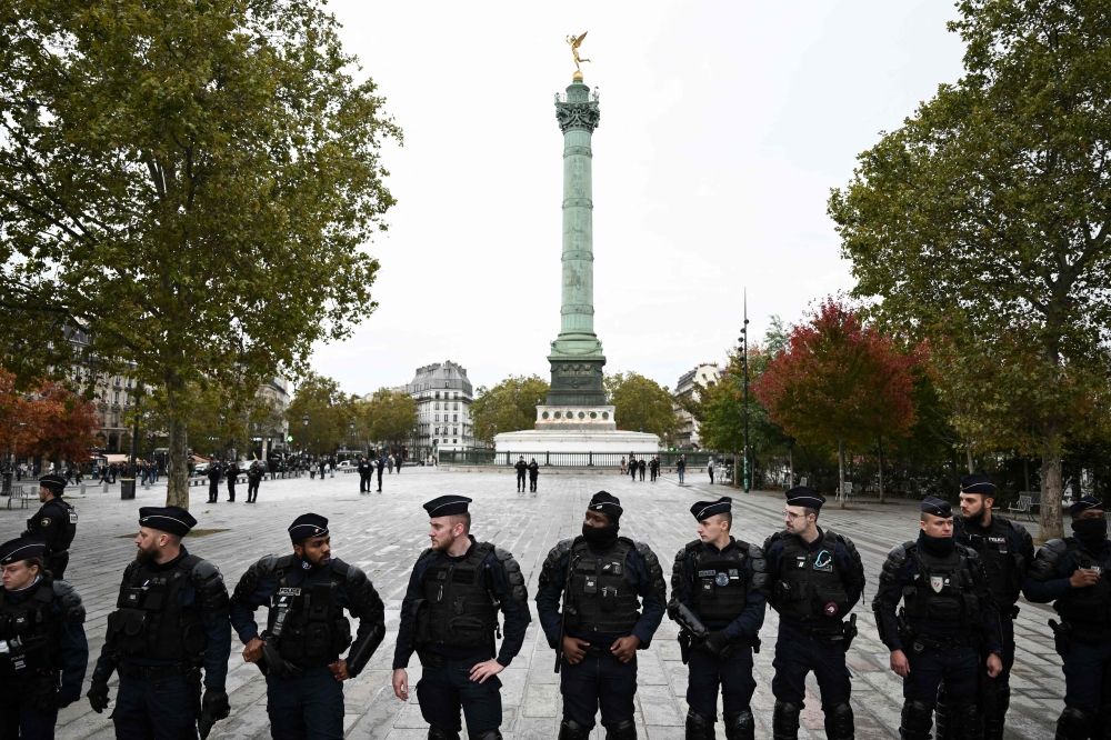Police officers stand guard at the Place de la Bastille. — AFP pic Police officers stand guard at the Place de la Bastille. — AFP pic