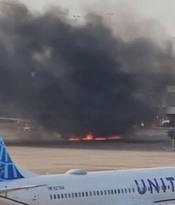 Passengers evacuate onto wing of burning American Airlines jet