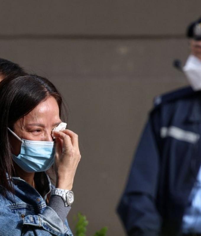 Grief and grim photos: Hong Kong families search for loved ones after deadly blaze