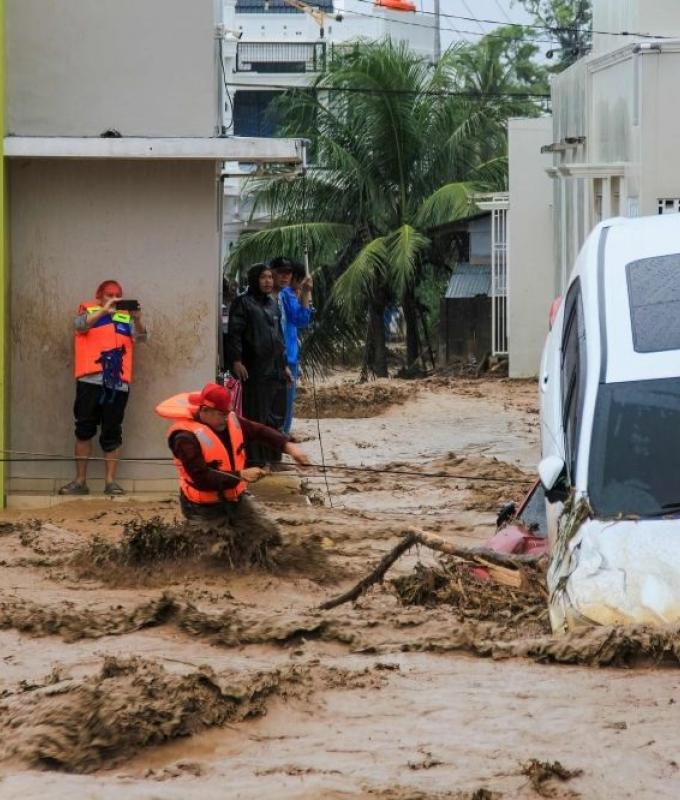 Clean-up begins in Thailand and Indonesia after catastrophic floods claim hundreds of lives